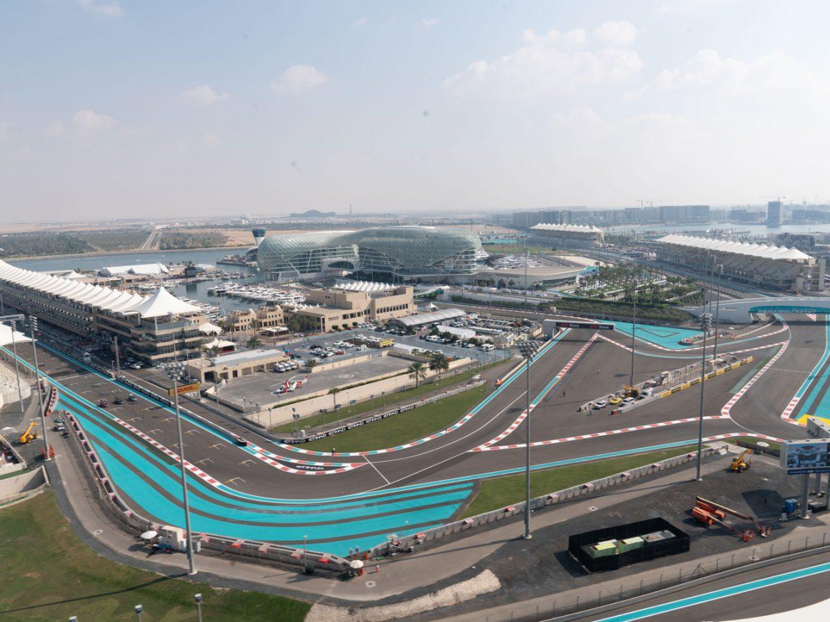 Drive your car around the track at Yas Marina Circuit